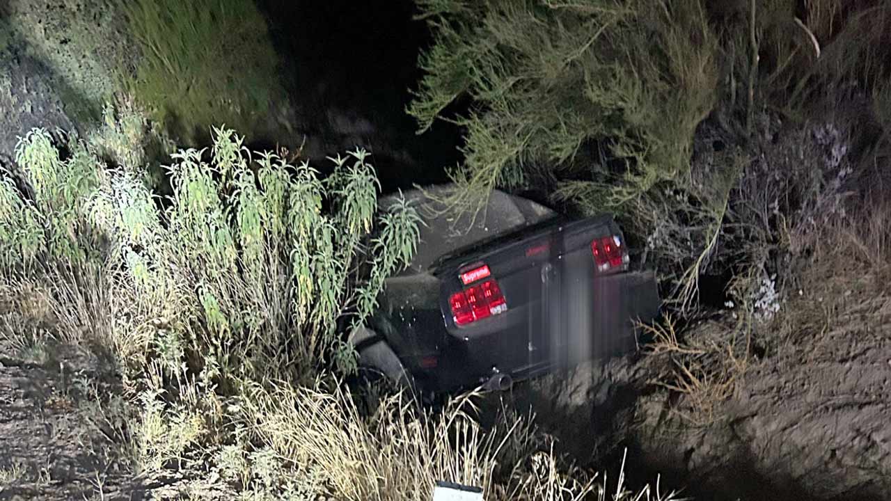 A vehicle driven by a suspected drunk driver is seen in a ditch after hitting a power pole in Black...