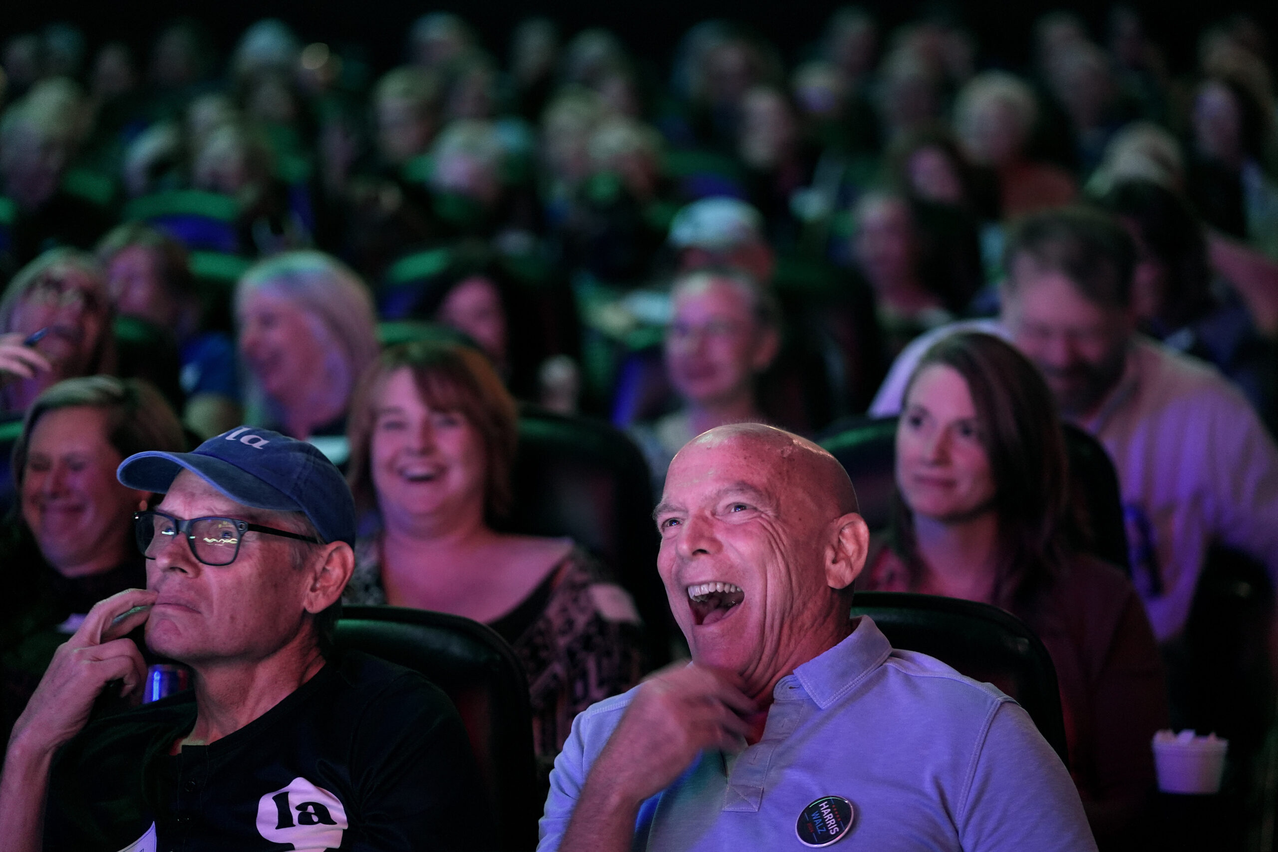 Chris Covert, front right, from Leawood, Kan., watches the presidential debate between Republican p...