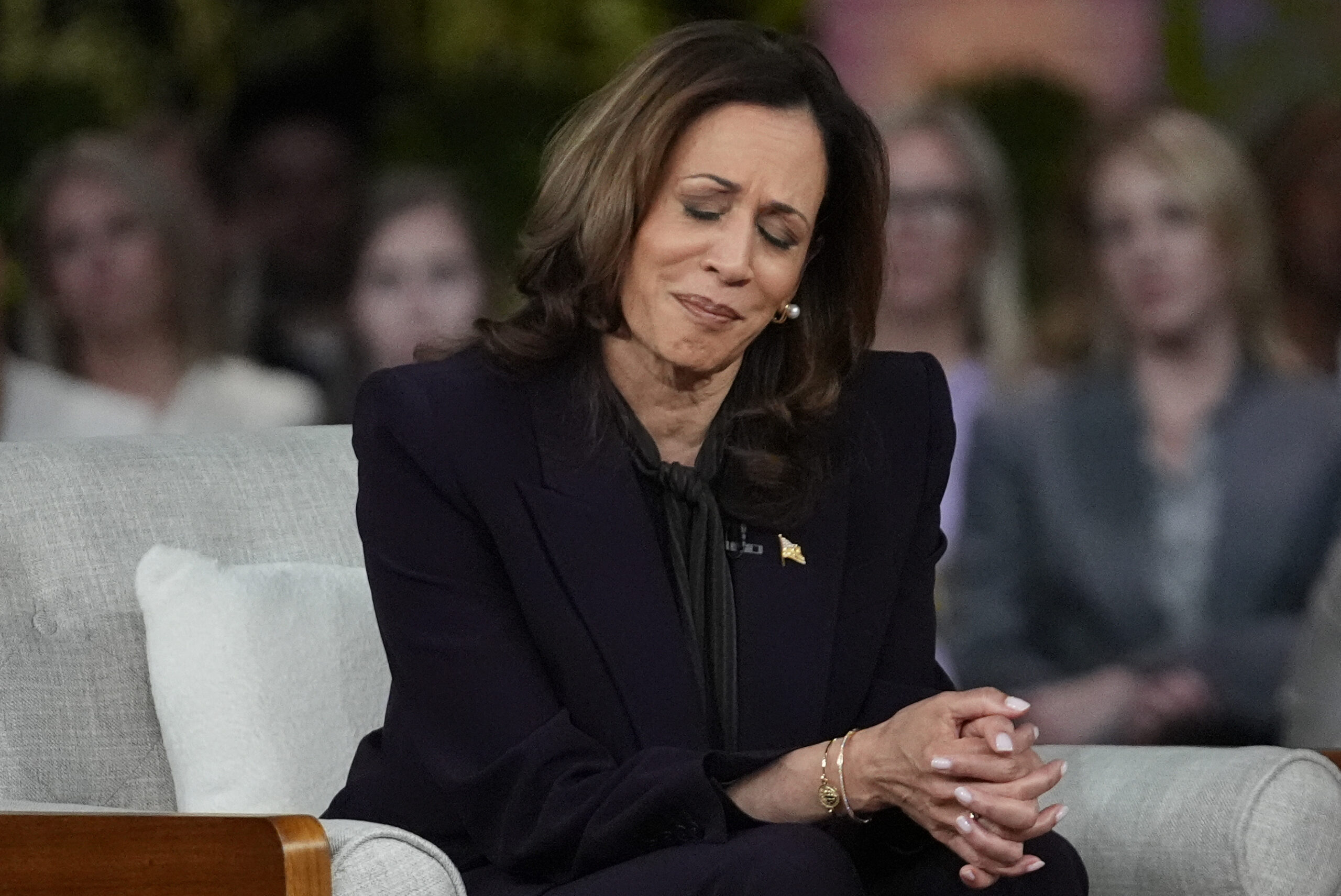 Democratic presidential nominee Vice President Kamala Harris listens to a parent's survivor story a...