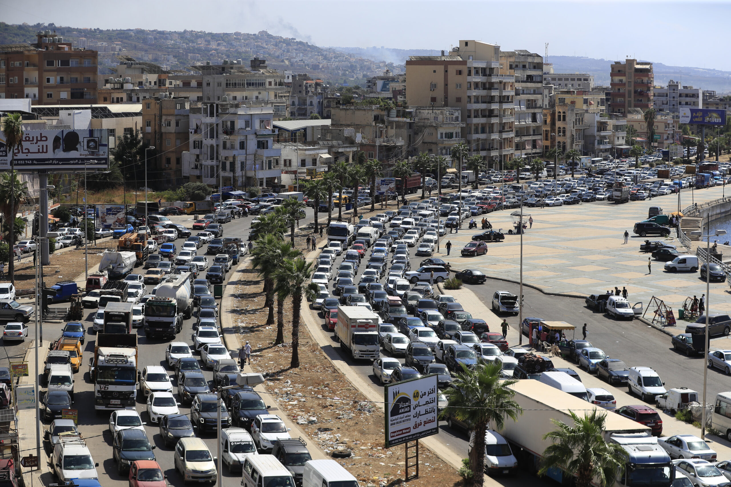 Cars sit in traffic as they flee the southern villages amid ongoing Israeli airstrikes, in Sidon, L...