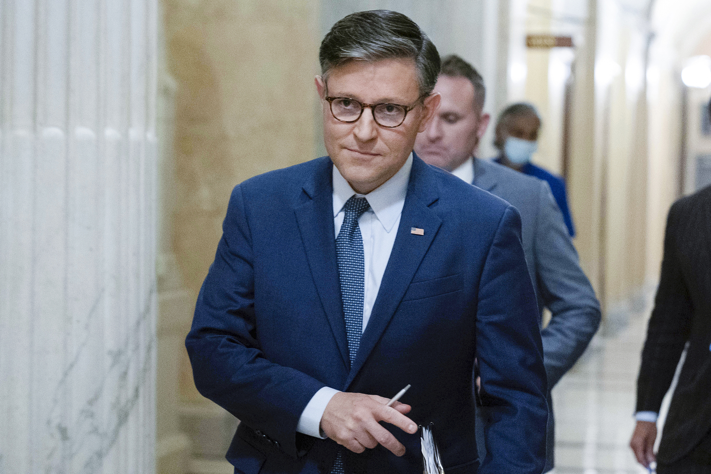 FILE - Speaker of the House Mike Johnson, R-La., walks to a meeting at the Capitol in Washington, S...