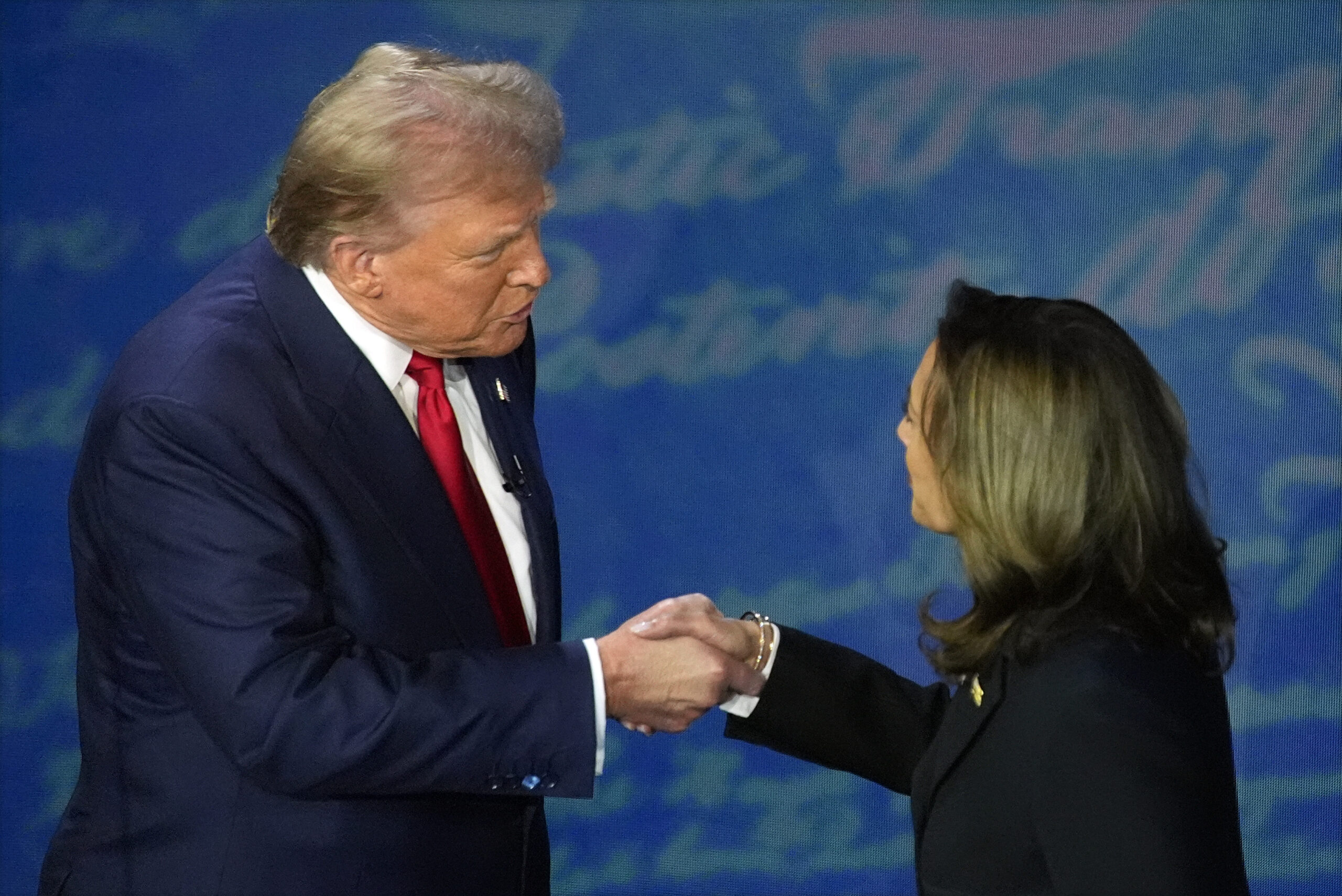 Republican presidential nominee former President Donald Trump shakes hands with Democratic presiden...