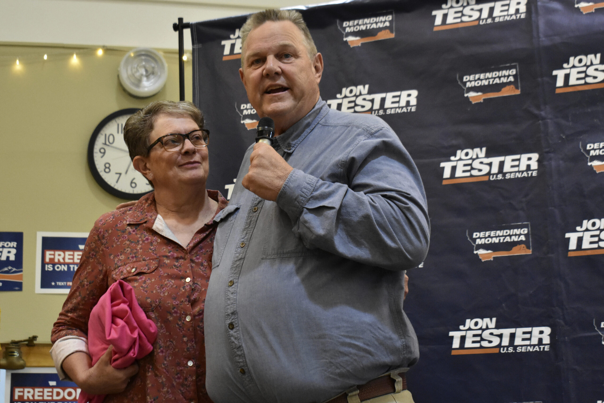 U.S. Sen. Jon Tester, D-Mont., speaks while standing next to his wife, Sharla, at a campaign rally,...