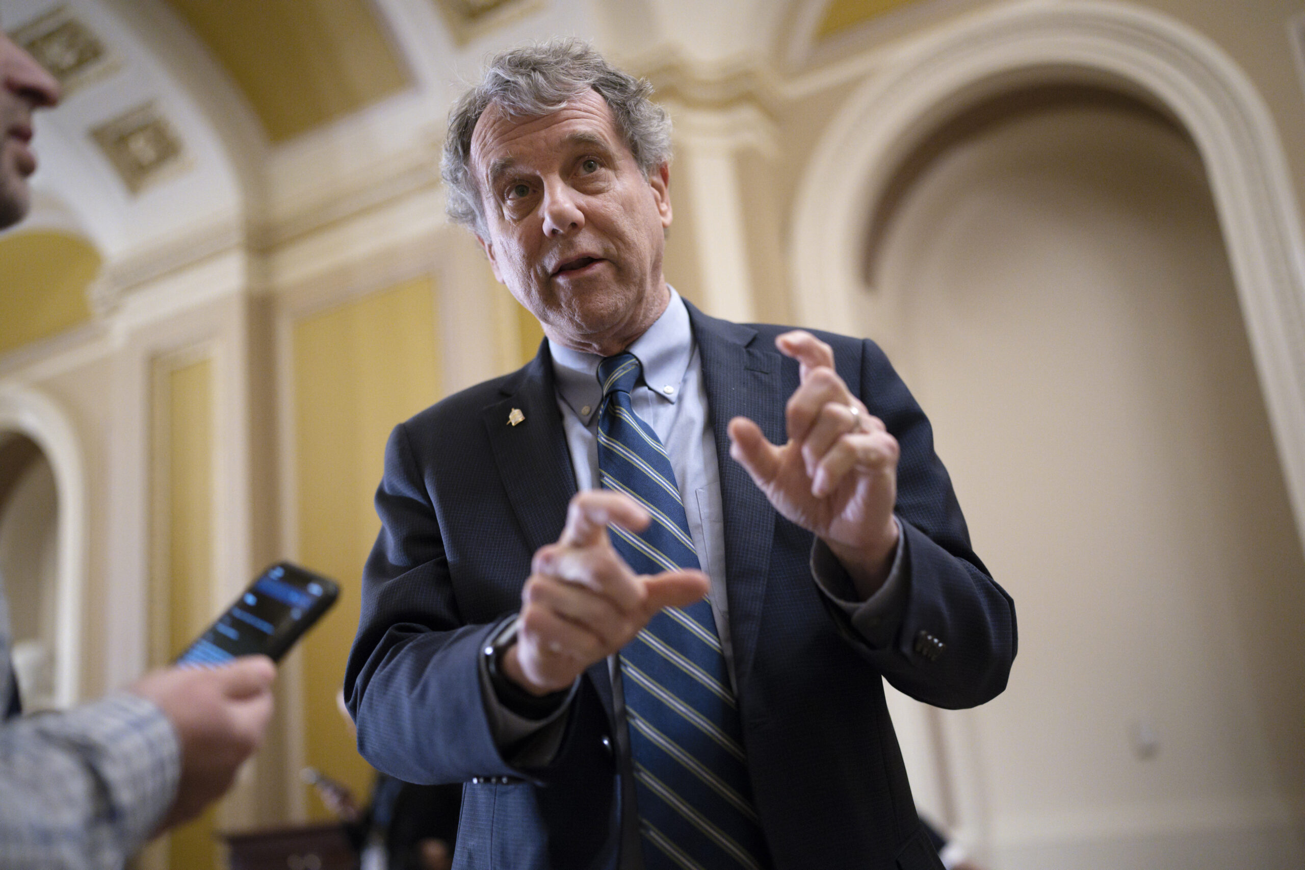 FILE - Senate Banking Committee Chairman Sherrod Brown, D-Ohio, speaks with reporters at the Capito...