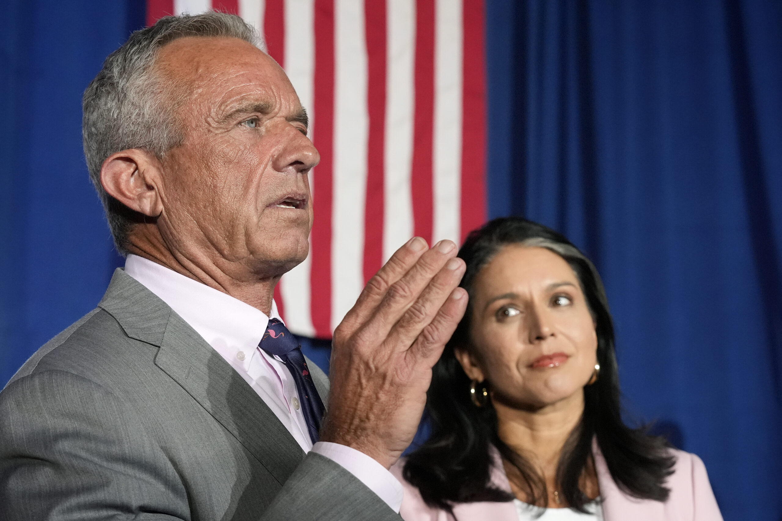 Former Independent candidate for president Robert F. Kennedy, Jr., left, answers a question as form...