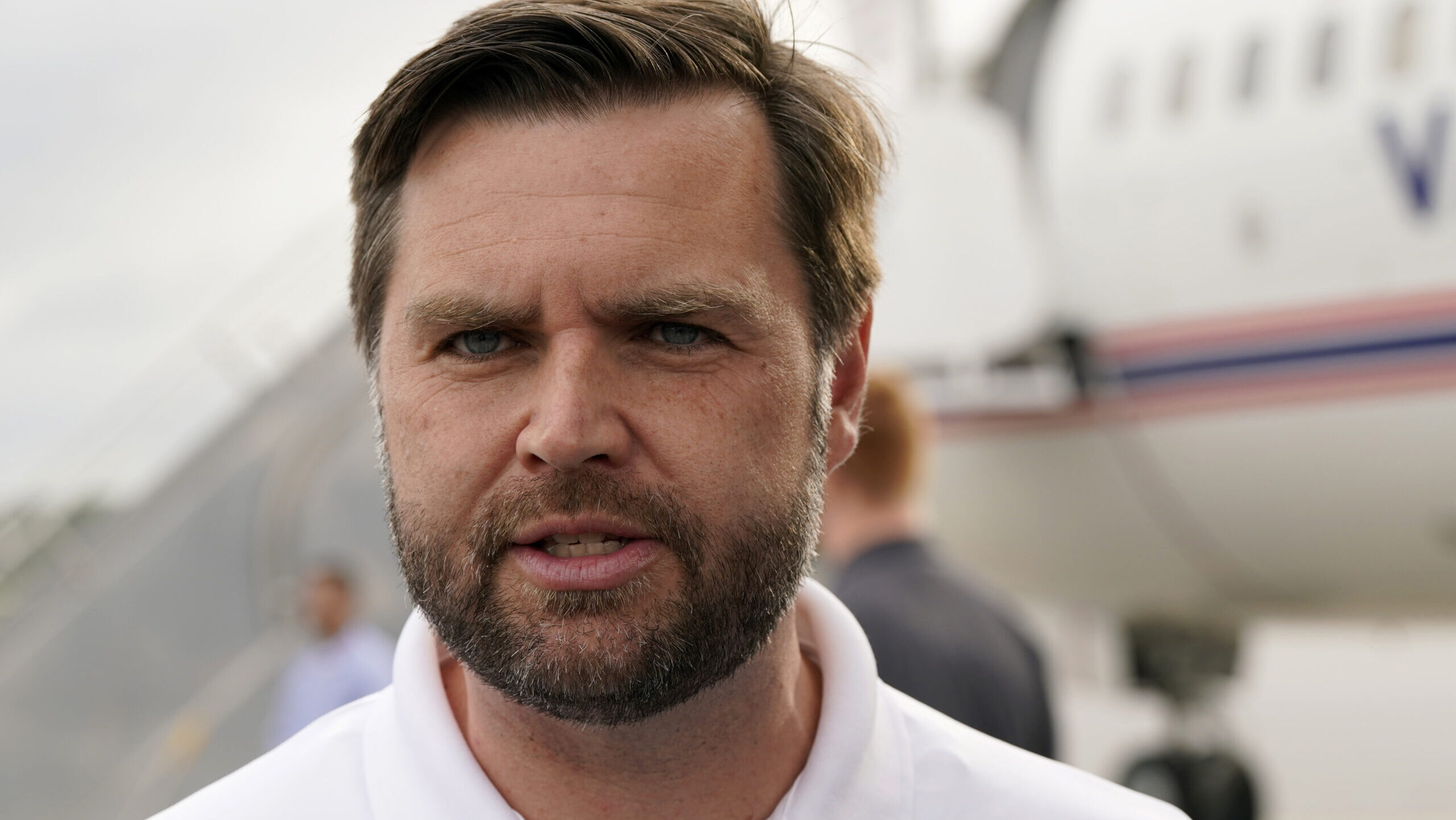 Republican vice presidential nominee Sen. JD Vance, R-Ohio, speaks to reporters before he departs P...