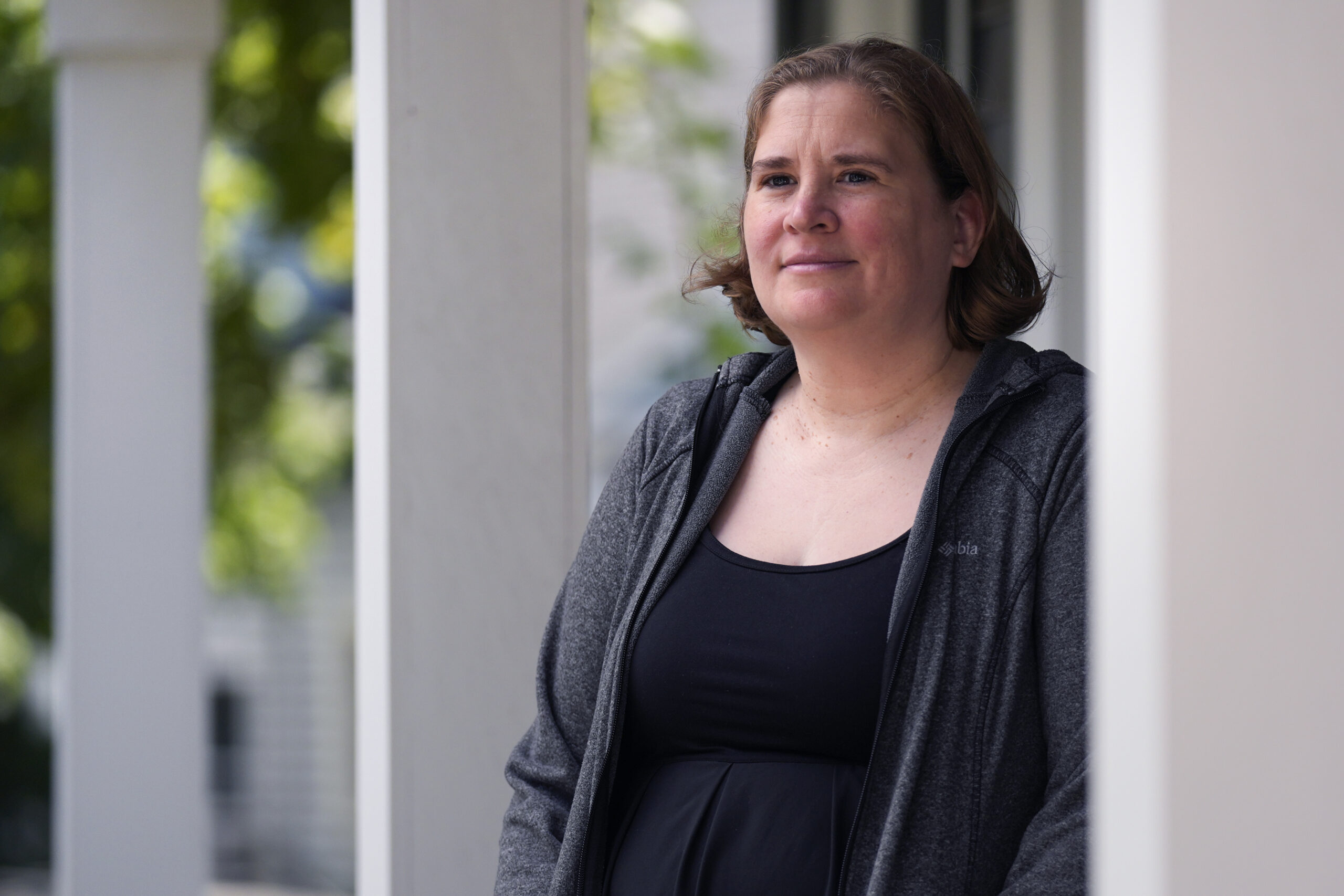 Rebecca Wood stands for a portrait outside her home, Friday, Aug. 30, 2024, in Maynard, Mass. Wood ...