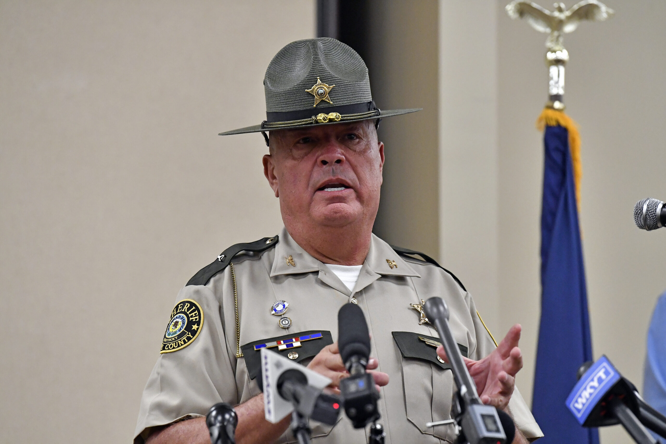 Laurel County sheriff John Root gives an update at the London Community Center in London, Ky., Sund...