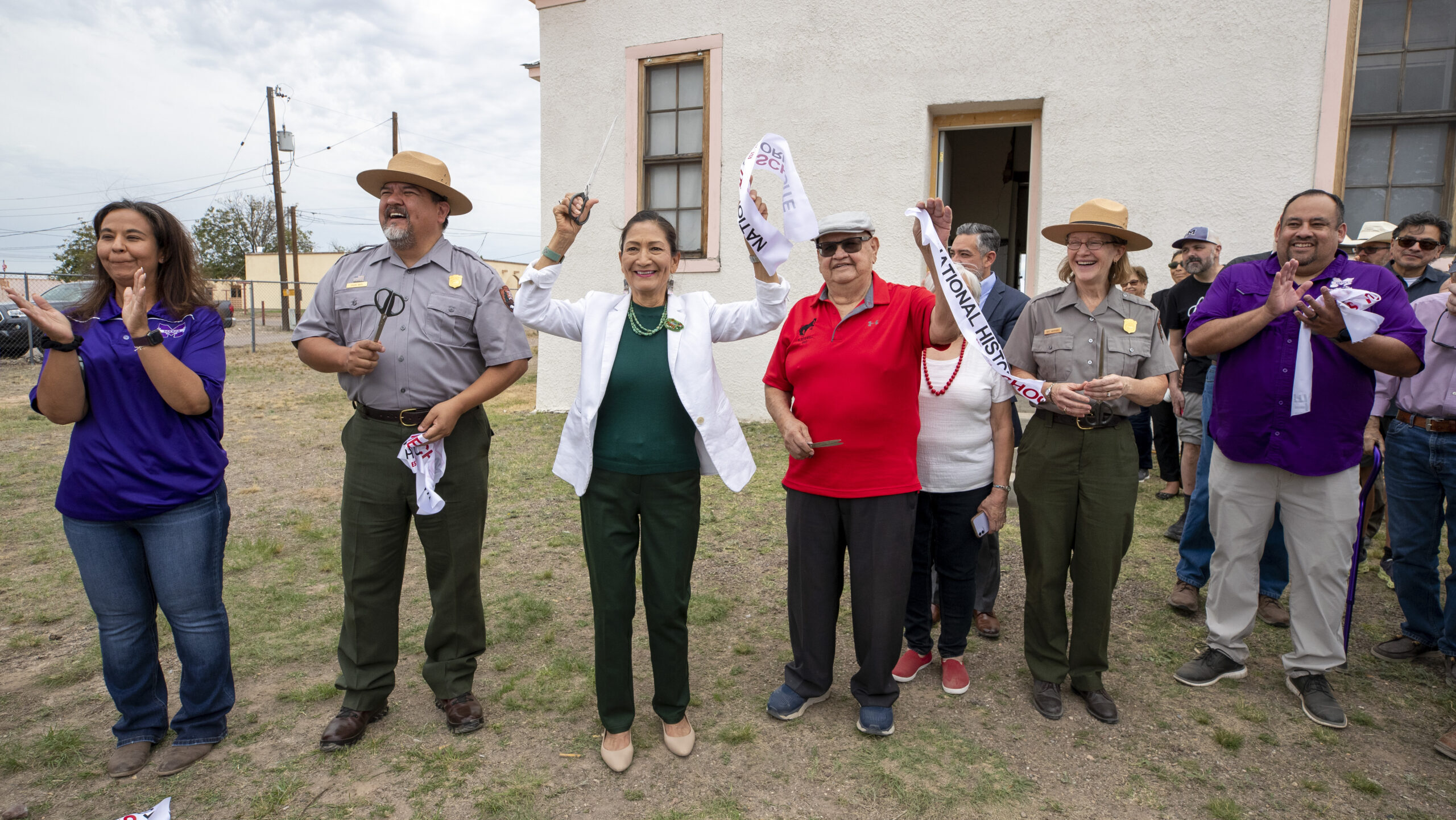 Secretary of the Interior Deb Haaland, center left, Blackwell School alumni Joe Cabezuela, center r...