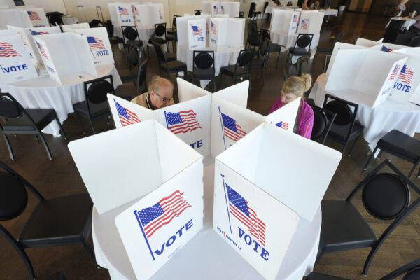 Voters at a ballot box...