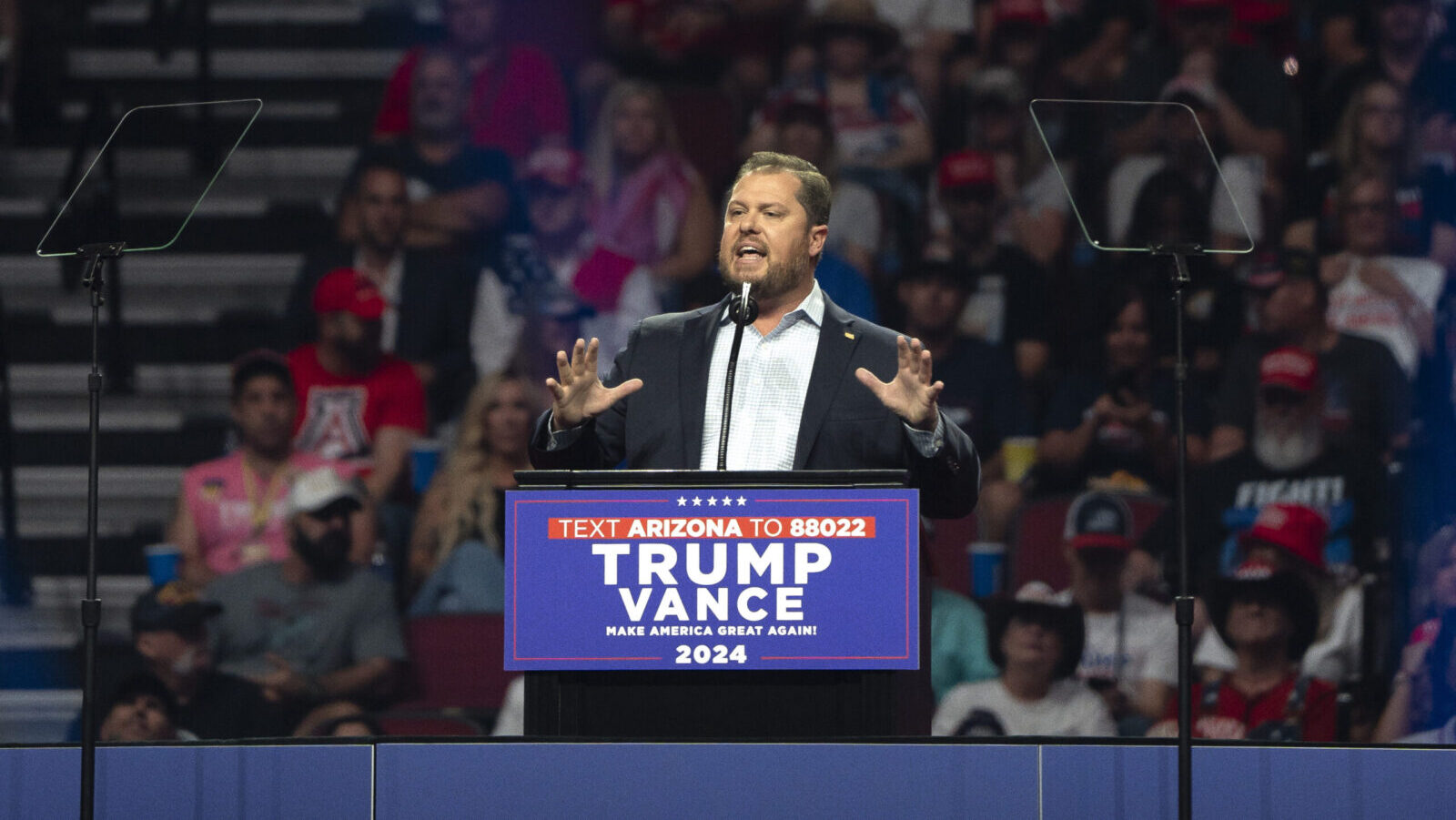 Arizona State Committee chairman Jake Hoffman speaks behind podium in Glendale, Arizona...