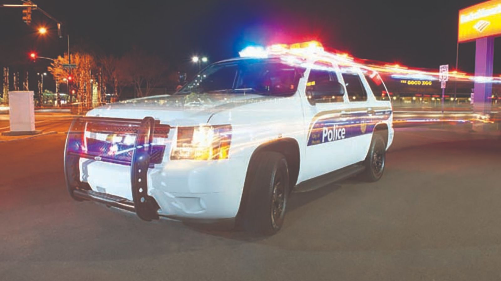 Phoenix Police car with flashing lights at night...