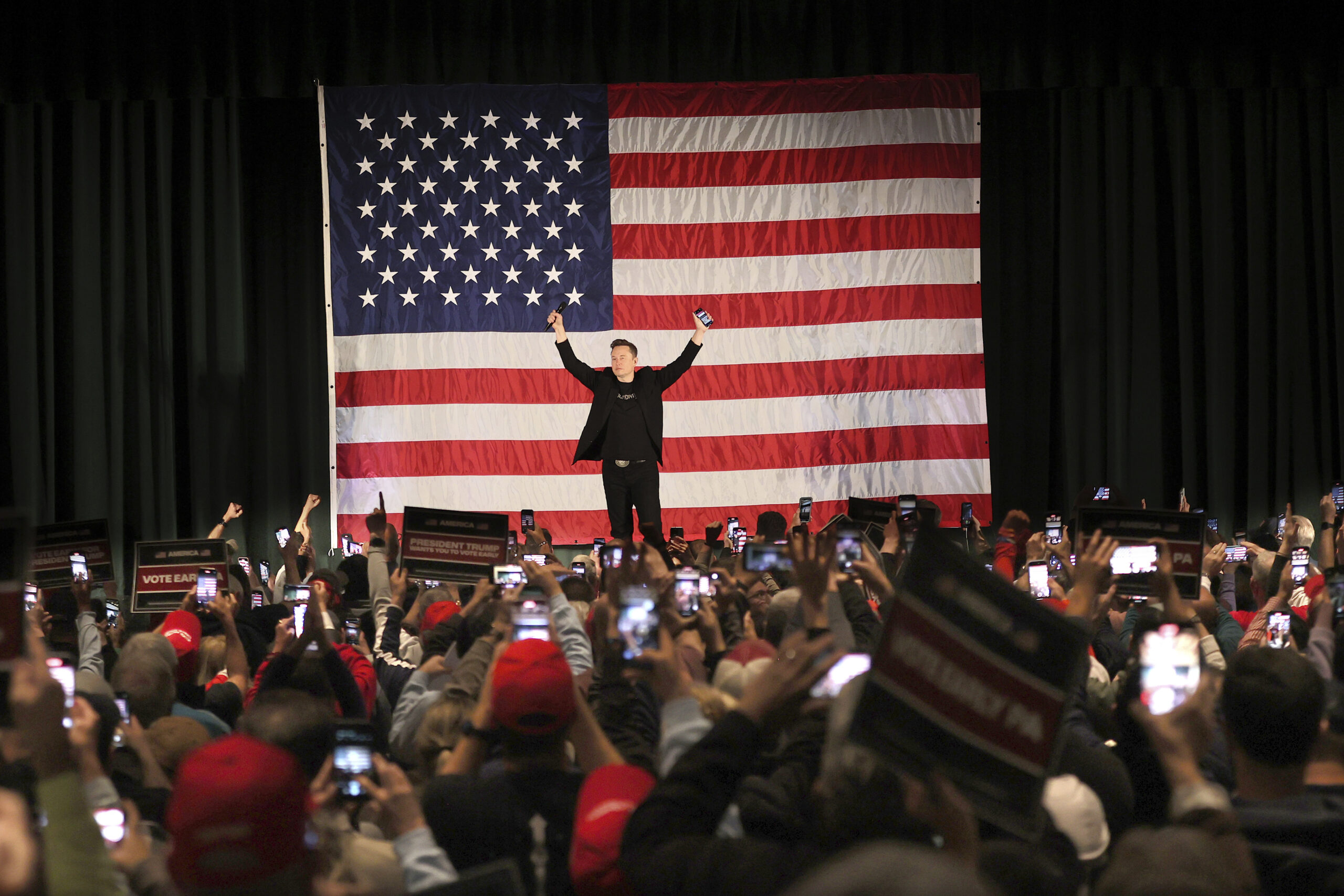 Elon Musk leads a America PAC Town Hall in Delaware County, Pa., at Ridley High School on Thursday,...