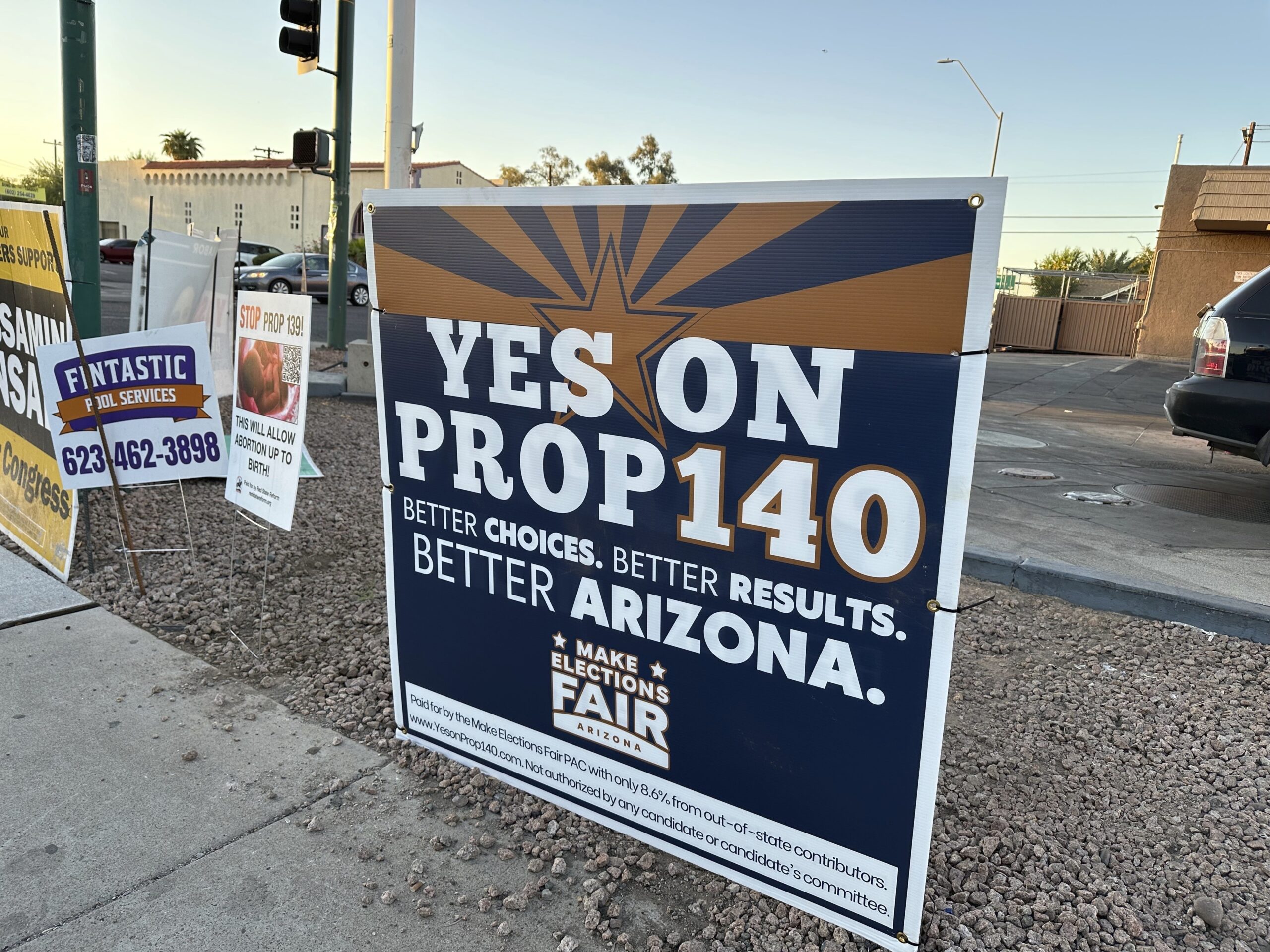 A yard sign is seen Thursday, Oct. 17, 2024, at a Phoenix intersection promoting Prop 140, which wo...