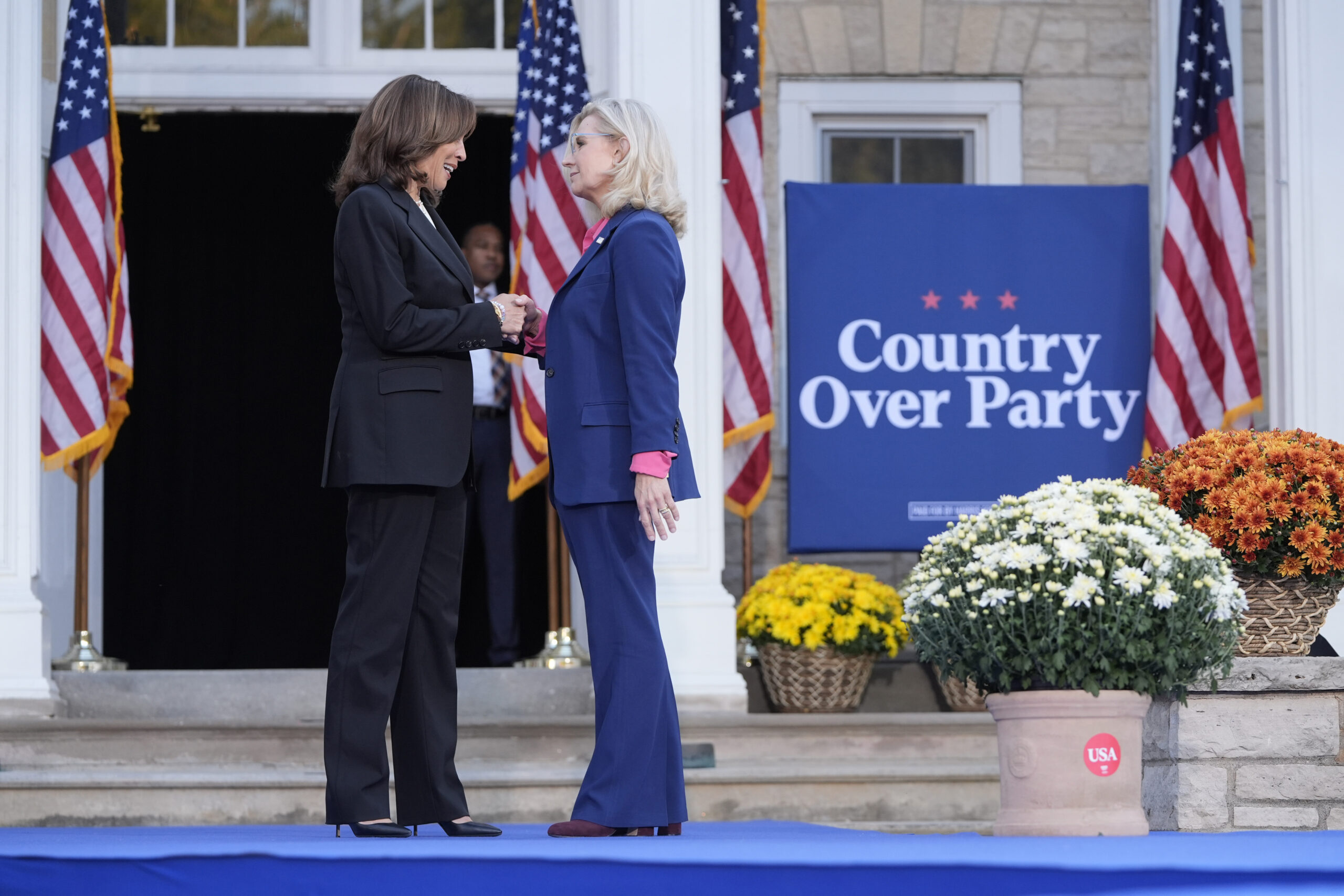 Democratic presidential nominee Vice President Kamala Harris, left, is greeted by former Congresswo...