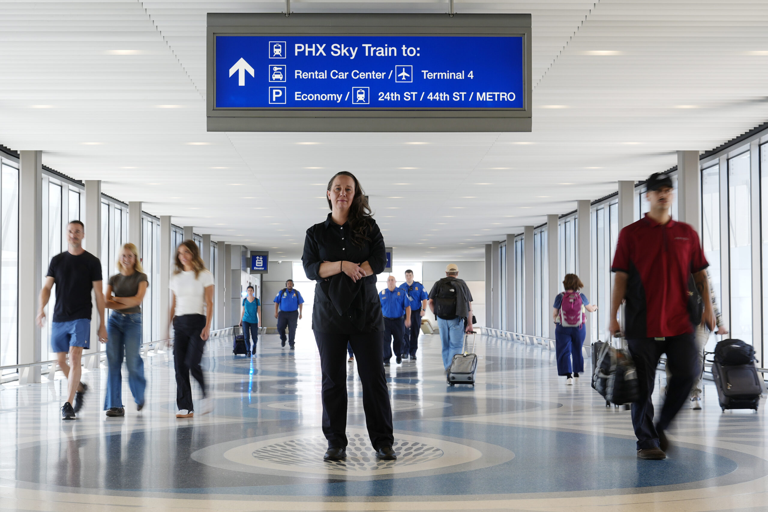 Lindsay Ruck, a server at Phoenix Sky Harbor International Airport restaurants, pauses in Terminal ...