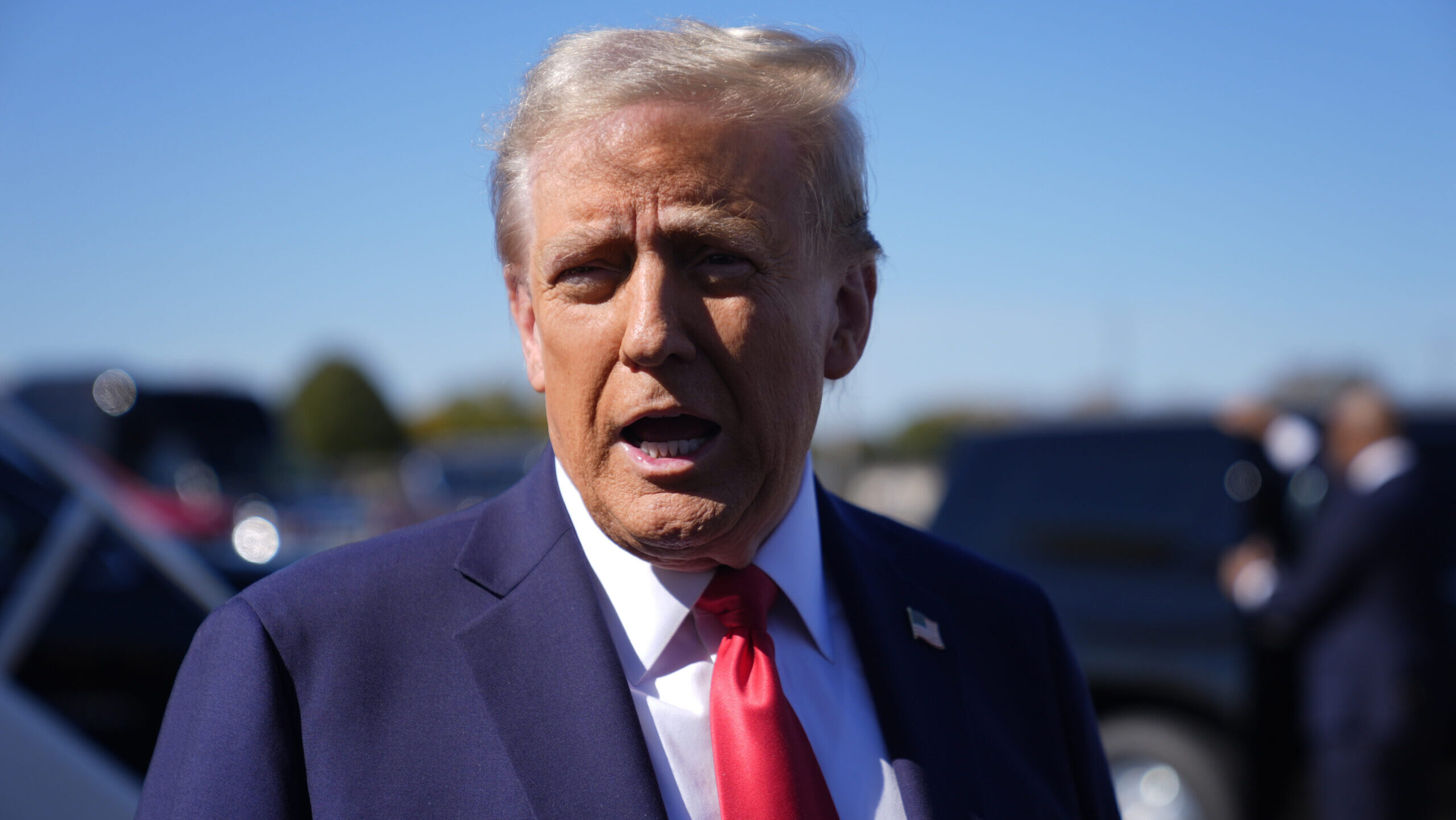 Republican presidential nominee former President Donald Trump speaks with reporters upon arrival at...