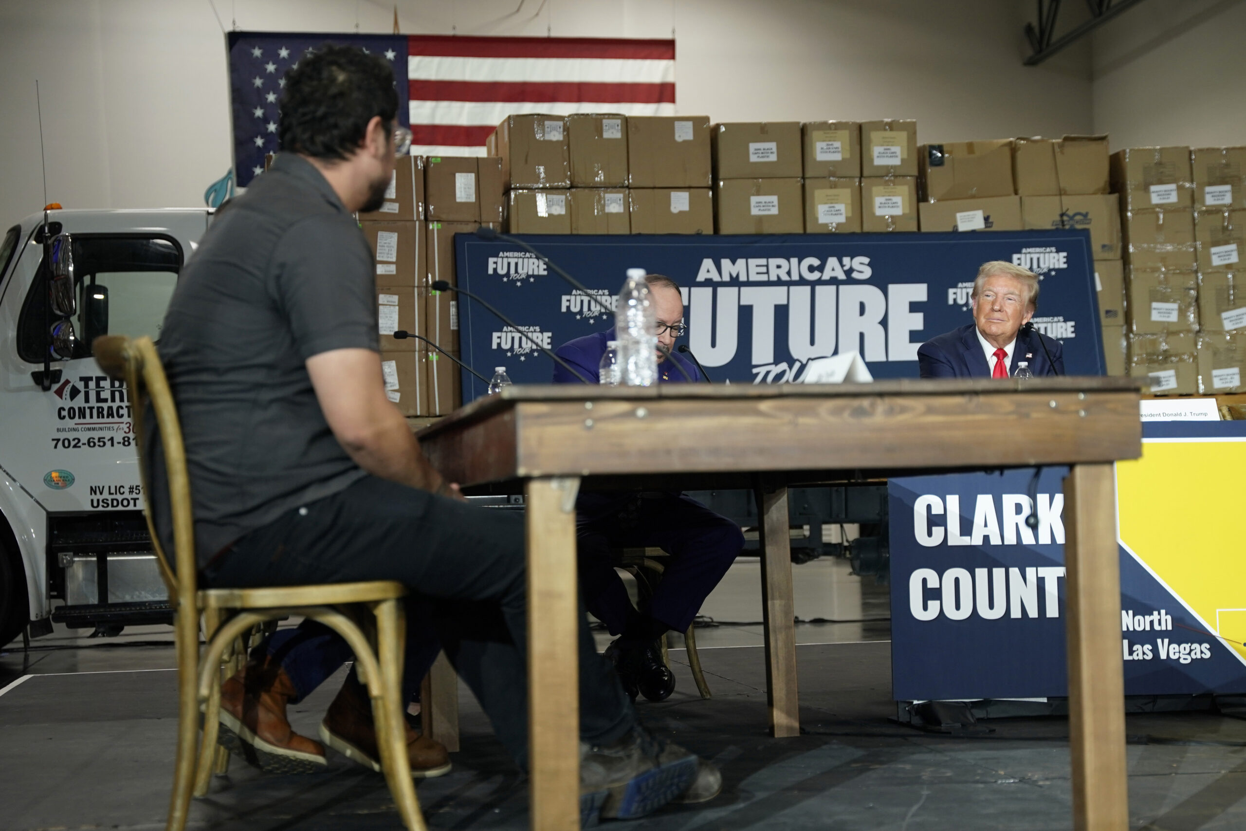 Elias Trujillo, left, speaks as Republican presidential nominee former President Donald Trump, from...