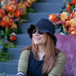 20240127 - Tempe Blooms - Tempe, Ariz. - woman smiles in front of floral display