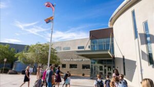 Why do Arizona districts reapprove budgets after the school year is complete?