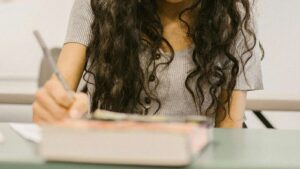 Why are Arizona Latino students trailing in test scores, and how can the gap be closed?