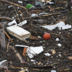 Debris is left behind by a raging Guadalupe River, Friday, July 4, 2025, in Kerrville, Texas. (AP Photo/Eric Gay)