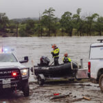 Members of Task Force 1 deploy boats along the Guadalupe River in the wake of a destructive flooding event in Kerrville on Friday July 4, 2025. (Christopher Lee/The San Antonio Express-News via AP)