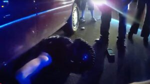Newly released footage shows Phoenix sergeant helping save motorcyclist trapped under car