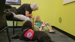 Phoenix program lets kids read to dogs at libraries to help boost confidence and literary skills
