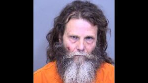 Man charged with murder, animal abuse after East Valley hotel shooting