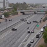 An officer shot a suspect who was running from police on a Mesa freeway  Sunday afternoon.