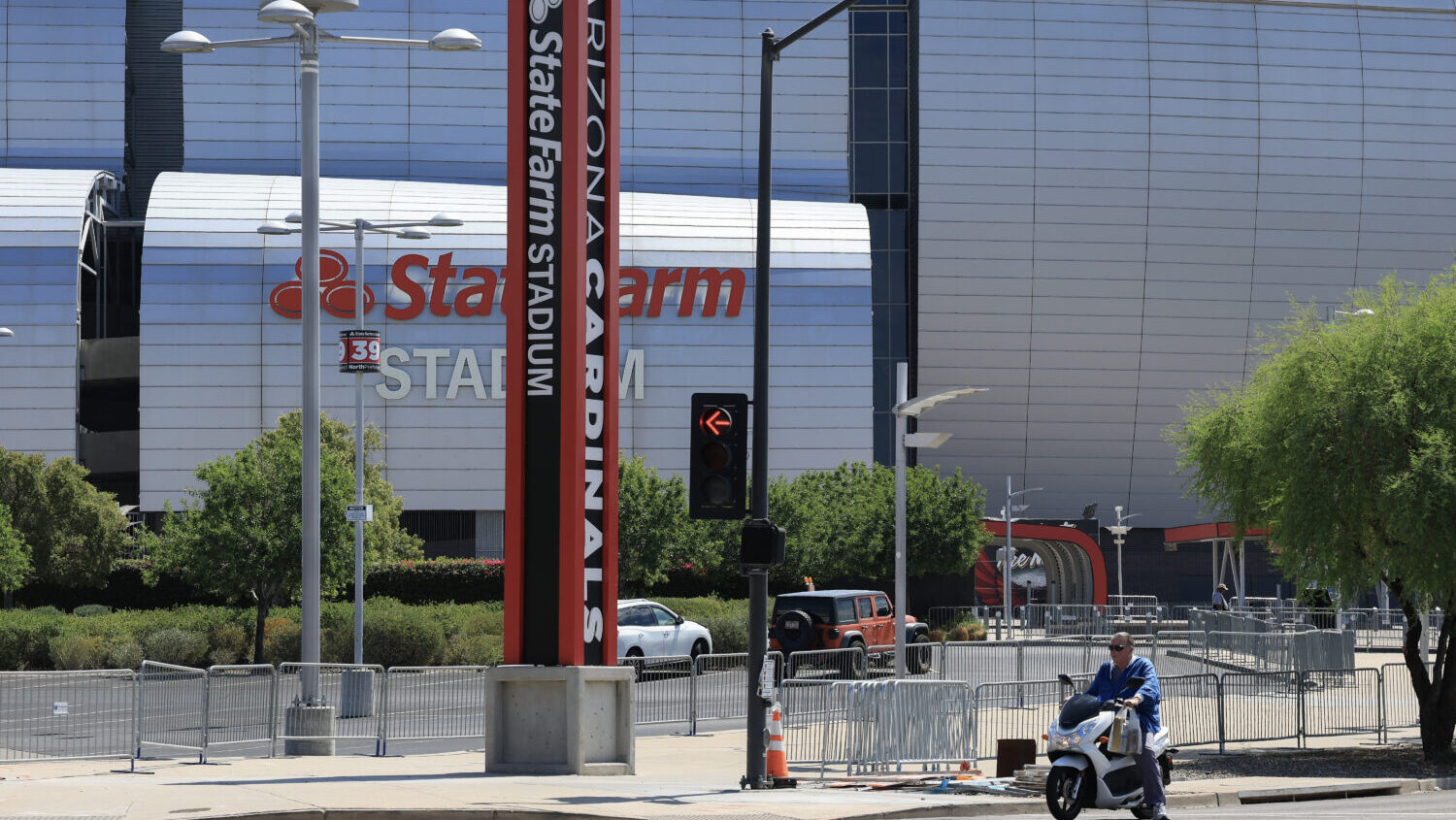 man claiming to be law enforcement in custody State Farm Stadium Charlie Kirk memorial...