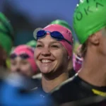 Racer smiles before swimming in Tempe Town Lake during Ironman Arizona triathlon. (Ironman photo)