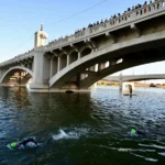Racers swim in Tempe Town Lake during Ironman Arizona triathlon. (Ironman photo)