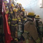 Students practice moving in their gear at Coronado High School’s new Fire Science Academy. (Shira Tanzer/KTAR News)