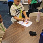 Campers at Camp Innovation work on robots. (KTAR News photo/Shira Tanzer)