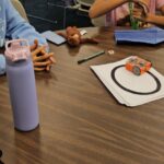 Campers at Camp Innovation work on robots. (KTAR News photo/Shira Tanzer)