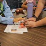 Campers at Camp Innovation work on robots. (KTAR News photo/Shira Tanzer)