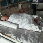 Rose Dexter is pictured being treated for infantile botulism at Phoenix Children’s Hospital. (Stephen Dexter via AP)