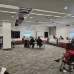 Teachers speak to the Phoenix Union board about a motion to cut 167 jobs. (Shira Tanzer/KTAR News)