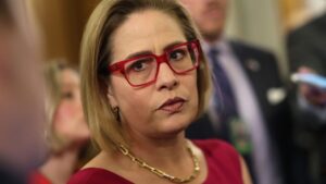 Lawsuit accuses Kyrsten Sinema of breaking up her bodyguard's marriage while in office