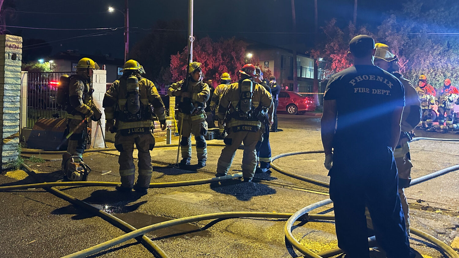 Two dogs died and three people, including a police officer, suffered smoke inhalation in an apartme...