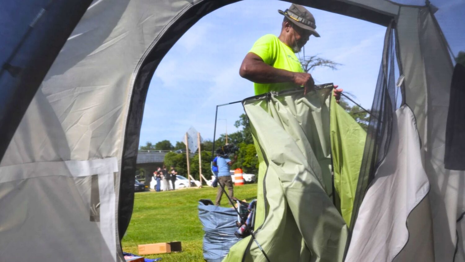George M., who has been living at a tent encampment, packs up his tent, Thursday, Aug. 14, 2025 in ...