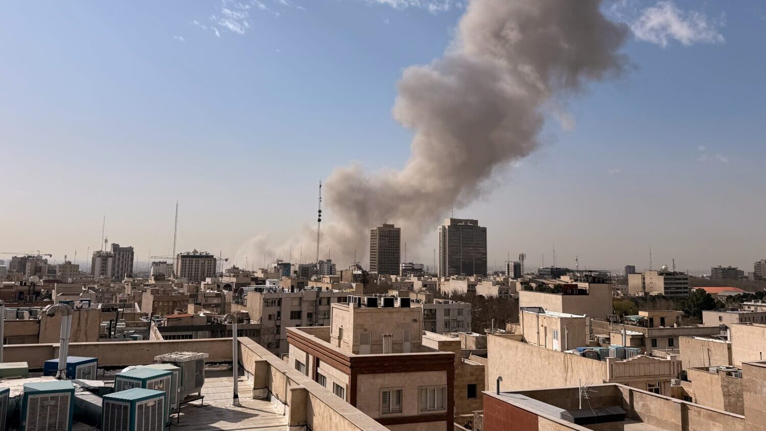 Smoke rises on the skyline after an explosion in Tehran, Iran, Saturday, Feb. 28, 2026.(AP Photo)...
