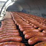 Caldwell County BBQ sausage links on grill
