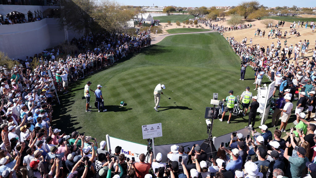 Scottie Scheffler of the United States plays his shot from the 11th tee during the third round of t...