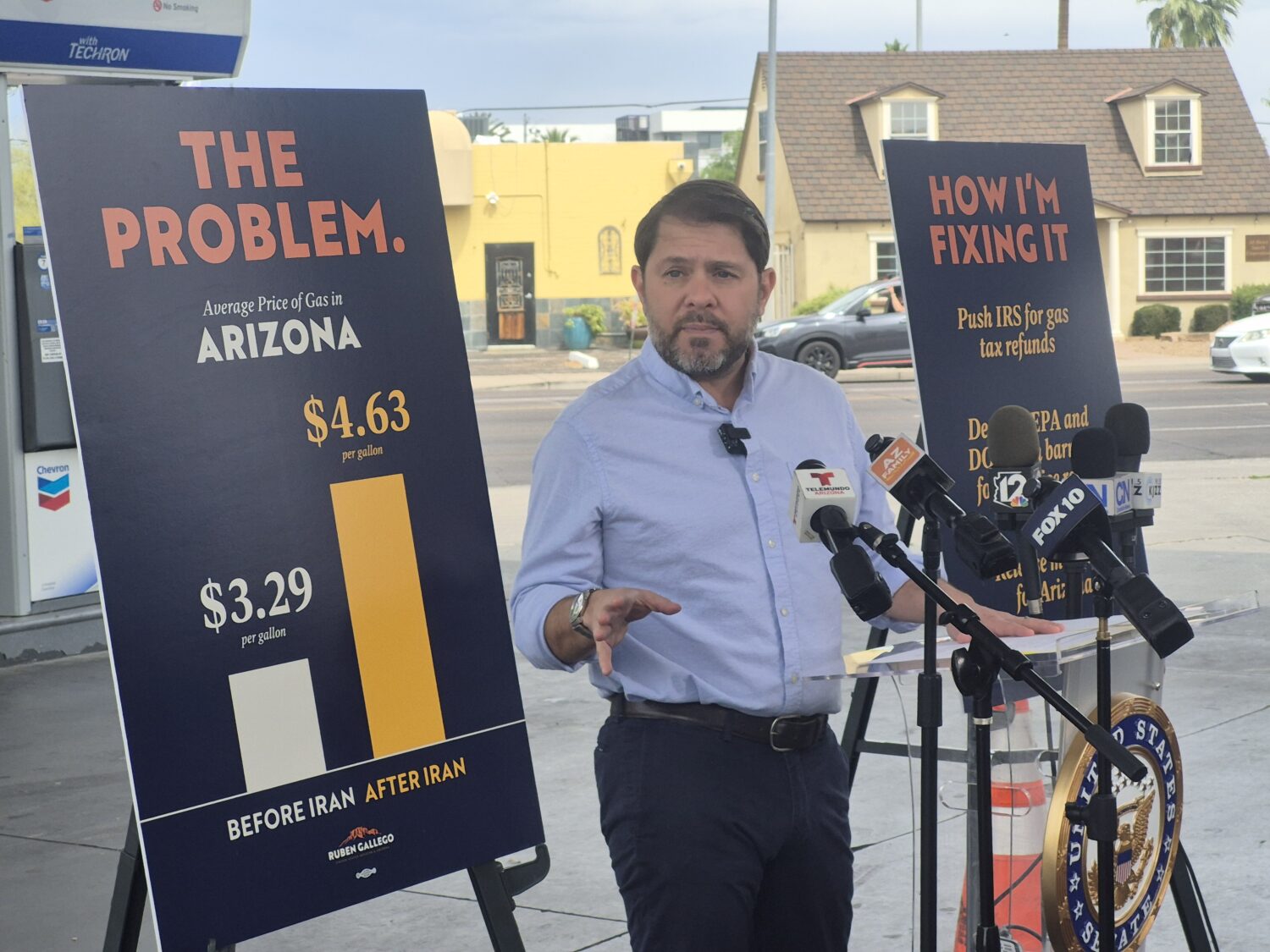 Sen. Ruben Gallego, D-Ariz., speaks to reporters about rising gas prices at a Phoenix gas station o...