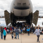 Local community members tour the inside of a U.S. Air Force C-5M Galaxy, assigned to Travis Air Force Base, California, during Luke Days 2024, March 24, 2024, at Luke Air Force Base, Arizona. Families and aviation enthusiasts alike gathered at Luke Days 2024 to marvel at thrilling performances, headlined by the U.S. Air Force Thunderbirds. (U.S. Air Force photo by Senior Airman Jakob Hambright)