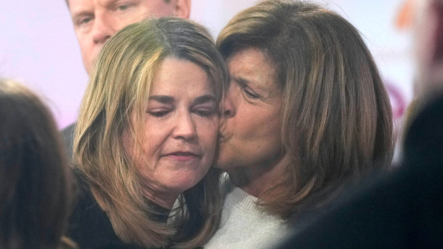 Savannah Guthrie, left, gets a kiss form Hoda Kotb during a visit to the Today show at Rockefeller ...