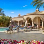 The ramada stands as a fully equipped outdoor retreat, outfitted with barbecues, televisions, and beer taps for effortless entertaining.